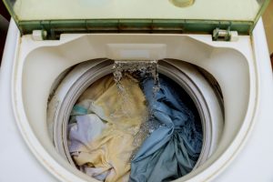 Internal view of a washing machine drum during wash into the washing machine