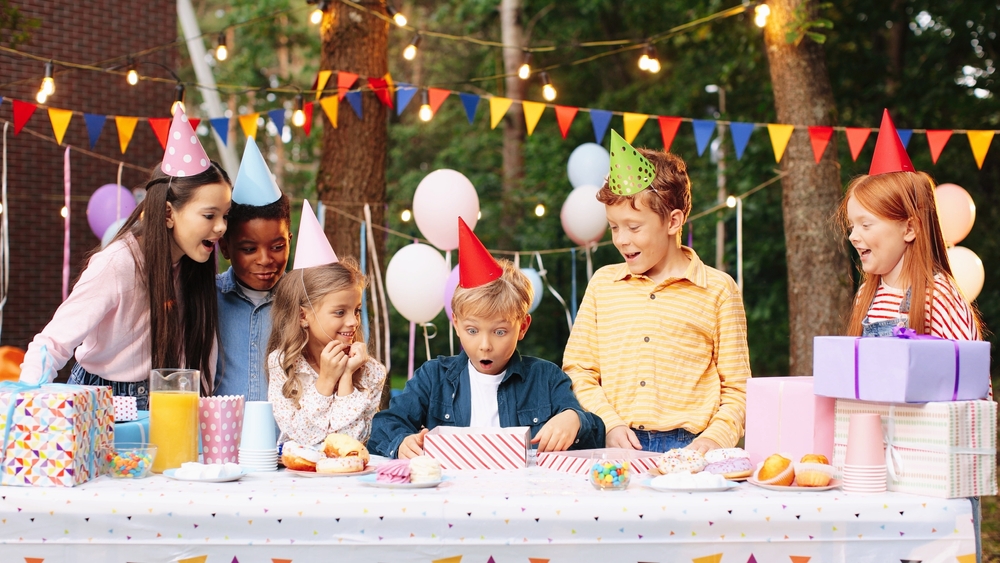 portrait,of,happy,child,boy,having,fun,to,opening,present